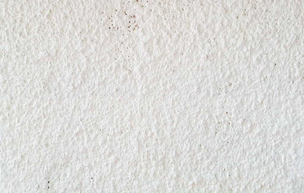 Waarom hebben bijna alle woningen in Spanje ruwe structuur-wanden?